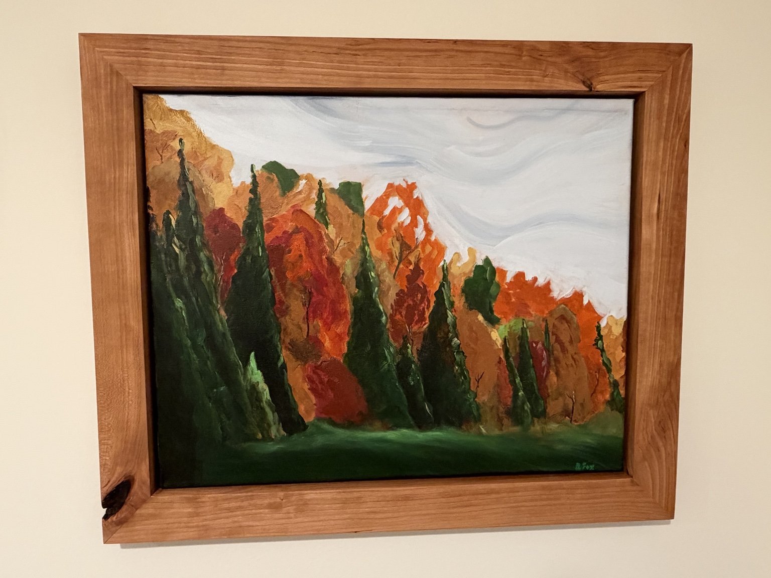 Autumn trees in orange and deep green, in a handcrafted wooden frame