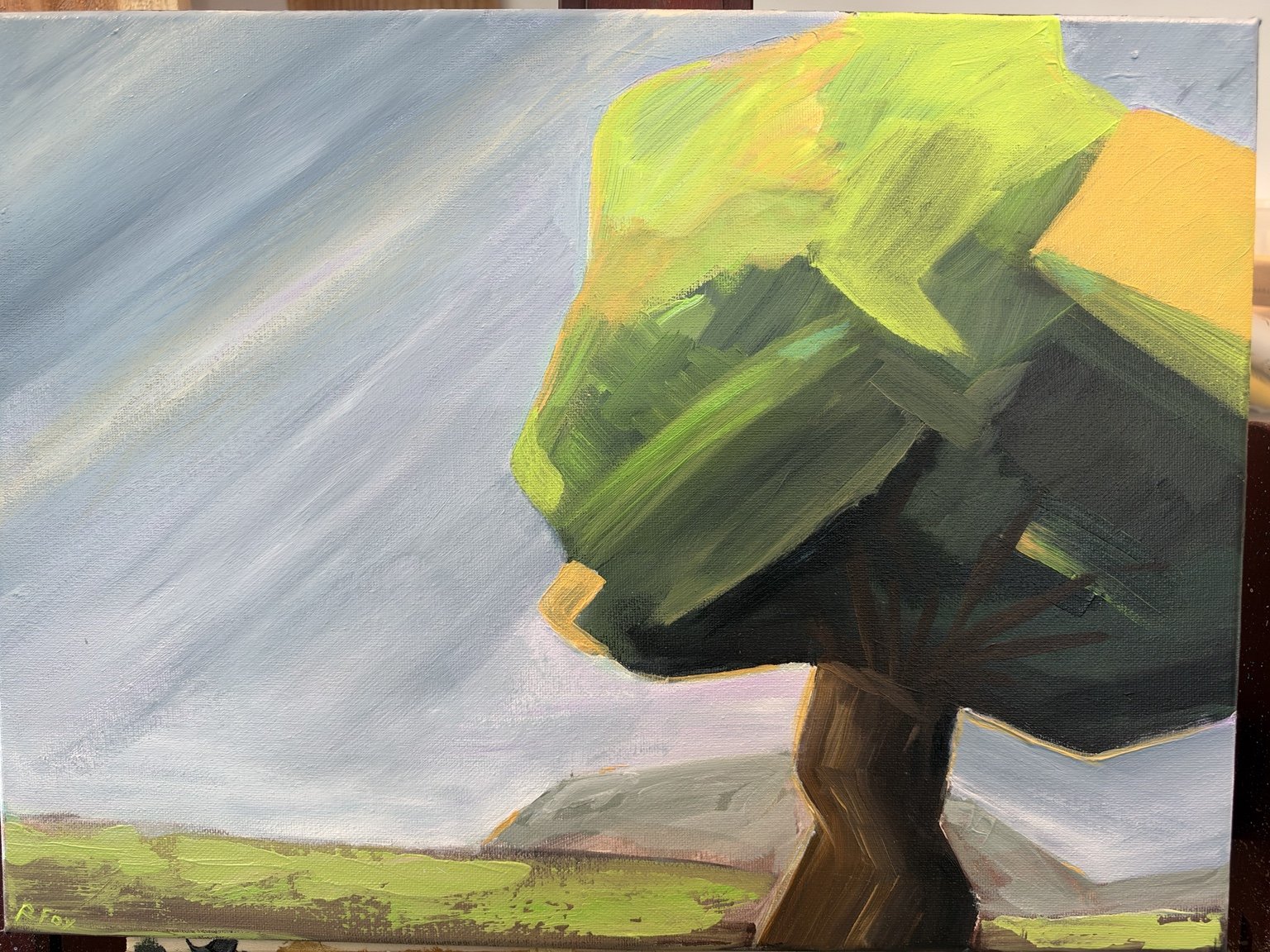 Expressive green tree against a pale sky